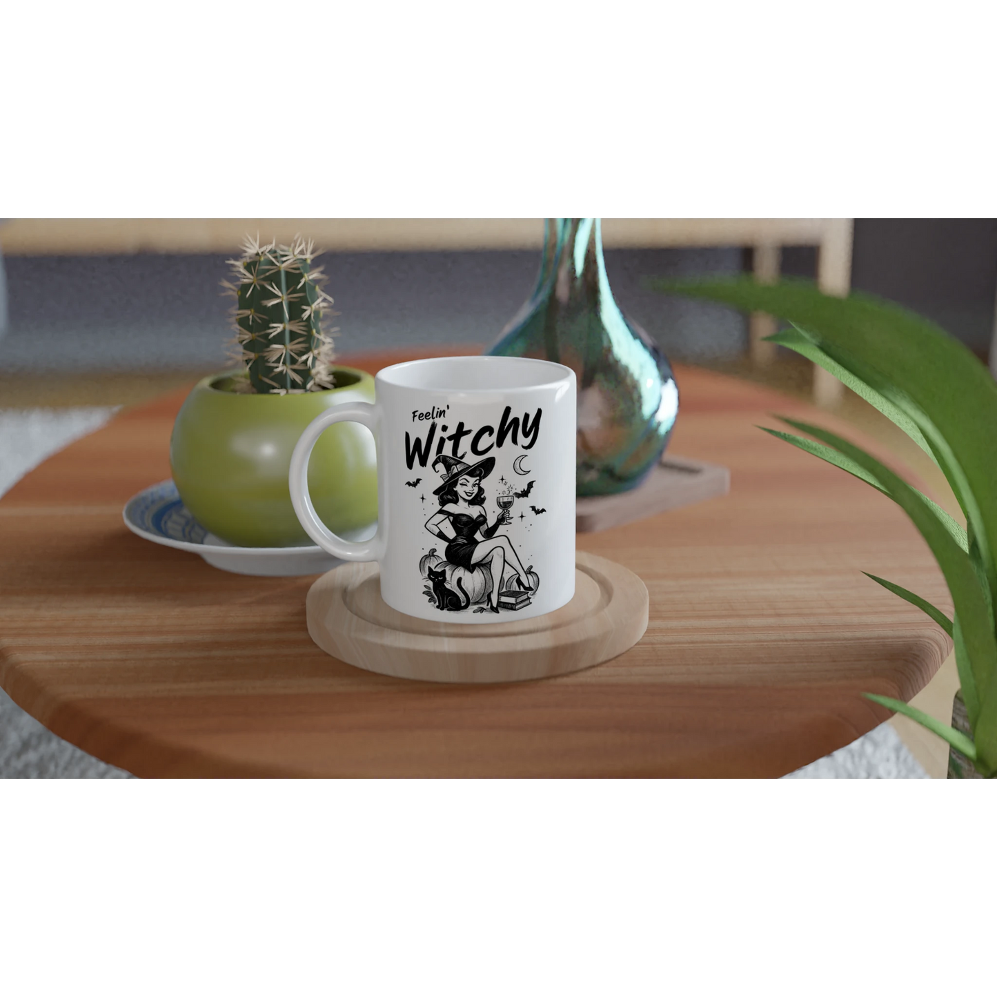 White mug with 'feels Witchy' design on a wooden table with plants and decor.