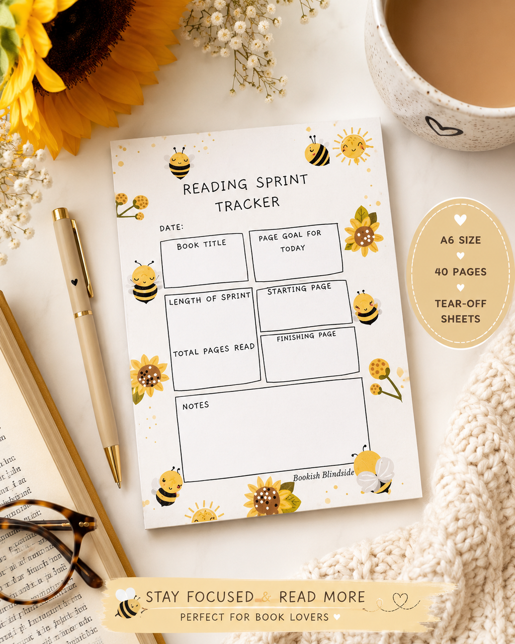 Reading sprint tracker with sunflower and bee design on a white surface with a cup of coffee and pen.